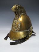 A 19TH CENTURY MERRYWEATHER BRASS FIREMANS HELMET, standard issue with chin strap