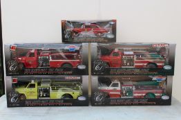 HIGHWAY 61 COLLECTIBLES - FOUR BOXED HEAVY DUTY FIRE TRUCKS, 1:16 die cast models, together with a