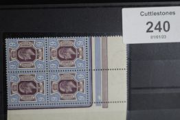 S.G. 307a KING EDWARD 9d DEEP PLUM AND BLUE, an UN/M bottom left corner marginal block of four