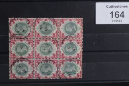 S.G. 214 1/= GREEN AND CARMINE, a FU block of nine with Strand CDS's, scarce