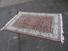 A LARGE EASTERN WOOLLEN RUG 222 X 153 CM