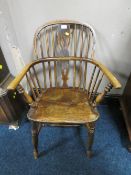 A SMALL 19TH CENTURY ELM WINDSOR ARMCHAIR