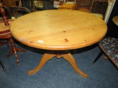 A HONEY PINE PEDESTAL TABLE