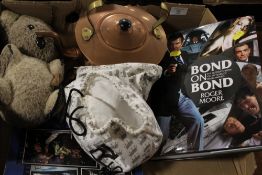 A TRAY OF ASSORTED SUNDRIES TO INCLUDE A ROGER MOORE JAMES BOND BOOK WITH SIGNATURE BUT NOT AUTHENTI