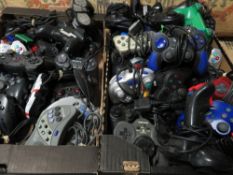 TWO TRAYS OF ASSORTED PLAYSTATION AND OTHER GAME CONTROLLERS ETC (APPROX 50)