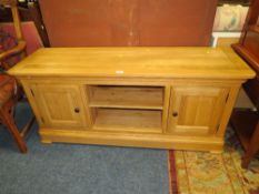 A MODERN LIGHT OAK MEDIA CABINET W-140 CM