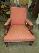 AN EDWARDIAN MAHOGANY UPHOLSTERED ARMCHAIR