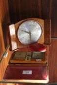 A DECO STYLE WESTCLOX MANTLE CLOCK TOGETHER WITH A CASED ESTYMA RADIO ALARM CLOCK AND A SMALL TRAVEL