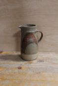 A LARGE STUDIO POTTERY STONEWARE JUG POSSIBLY BY MICHAEL CASSON