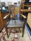 A TRADITIONAL OAK ARMCHAIR