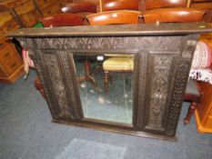 A 19TH CENTURY CARVED OAK 'GREEN MAN' OVERMANTLE MIRROR 97 X 122 CM