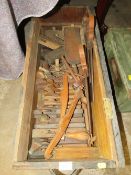 A WOODEN CRATE OF VINTAGE WOODWORKING PLANES