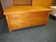AN OAK LOW SIX DRAWER COFFEE TABLE