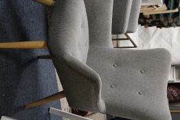 A MODERN GREY UPHOLSTERED CHAIR