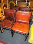 A SET OF FOUR TAN LEATHER INDUSTRIAL STYLE DINING CHAIRS