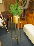 A MODERN GOLD PLANT STAND WITH FAKE FERN