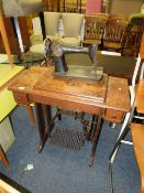 A SINGER TREADLE SEWING MACHINE