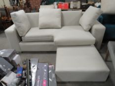 A LARGE MODERN UPHOLSTERED CREAM THREE SEATER SOFA AND LARGE STOOL (2)