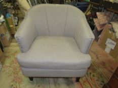 A MODERN UPHOLSTERED GREY COLOURED ARMCHAIR