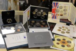 A LARGE QUANTITY OF COLLECTORS COIN SETS TO INCLUDE UNCIRCULATED SETS (ENTIRE SHELF)