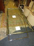 A MODERN GLASS TOPPED AND CHROME COFFEE TABLE 131 X 65 CM