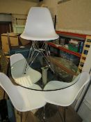 A MODERN CIRCULAR GLASS TABLE WITH FOUR WHITE CHAIRS