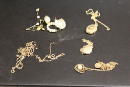 A SELECTION OF YELLOW METAL PENDANTS ETC