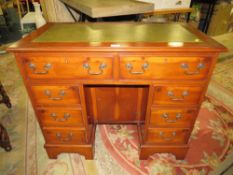 A MODERN LEATHER TOPPED YEW TWIN PEDESTAL DESK W-92 CM