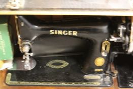 A CASED SINGER SEWING MACHINE EK938638 TOGETHER WITH A CASED IMPERIAL TYPEWRITER, CAMERAS ETC