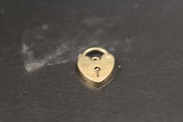 A 9CT GOLD CHARM BRACELET PADLOCK FASTENER