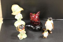A ROYAL DOULTON FLAMBE SEATED FOX, BESWICK JOAN WALSH ANGLUND, TWO BESWICK PENGUINS ETC