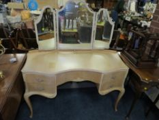 A VINTAGE KIDNEY SHAPED DRESSING TABLE