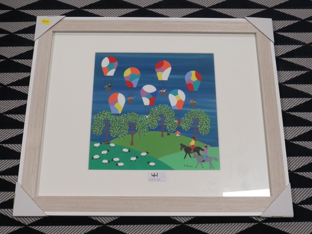 (XXI) GORDON BARKER - A MODERN FRAMED AND GLAZED PAINTING 'BALLOONS IN THE COUNTRYSIDE' - Image 2 of 3