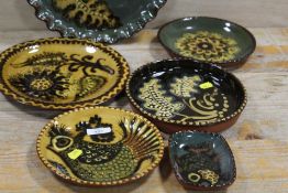 A COLLECTION OF STUDIO POTTERY STYLE DISHES SIGNED TO REVERSE HAMPTON 73