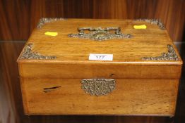 AN OAK BOX WITH BRASS MOUNTS AND HANDLE