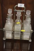 A VINTAGE SILVER PLATER SIX BOTTLE CRUET