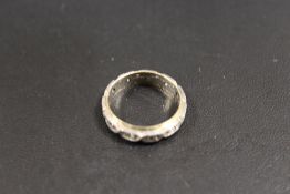 A VINTAGE 9CT GOLD AND SILVER ETERNITY RING