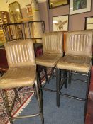 A SET OF THREE MATCHED LEATHER BAR/KITCHEN STOOLS