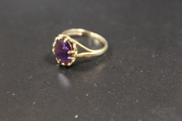 A 9CT GOLD AMETHYST DRESS RING
