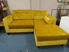 A LARGE MODERN MUSTARD UPHOLSTERED CORNER SUITE