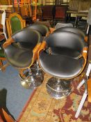 A SET OF FOUR EAMES STYLE ADJUSTABLE BAR/KITCHEN STOOLS