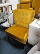 A LARGE MODERN UPHOLSTERED MUSTARD COLOURED ARMCHAIR