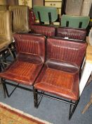 A SET OF FOUR TAN LEATHER INDUSTRIAL STYLE DINING CHAIRS