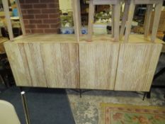 A LARGE MODERN LIMED FOUR DOOR SIDEBOARD W-200 CM