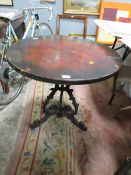 A CAST BASE CIRCULAR PUB STYLE TABLE