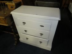 A SMALL WHITE PAINTED THREE DRAWER CHEST W-74 CM