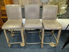 A SET OF THREE GREY LEATHER BAR STOOLS