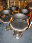 A SET OF FOUR EAMES STYLE ADJUSTABLE BAR/KITCHEN STOOLS
