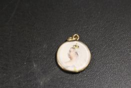 A VICTORIAN 9CT GOLD DOUBLE SIDED LOCKET