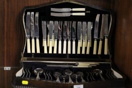 AN OAK CANTEEN OF CUTLERY AND CONTENTS